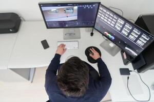 professional editor enhancing digital footage using specialized software photo