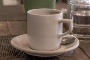 Cup of americano black coffee in restaurant cafe in Mexico. photo