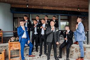 A group of men dressed in suits and ties are posing for a photo