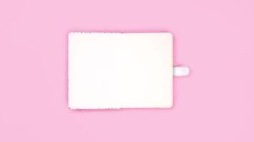 4k Blue vintage romantic diary book appear and open with copy space on pink background. Stop motion flat lay video