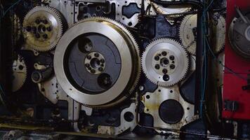 A fragment of the engine. Large cog wheels in the motor video