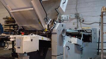 Offset printing machine at printing factory video
