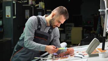 Designer used color palette to select the correct shade of color from Lab color space. Press color management print production. video