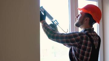 Windows installation worker use of foam when installing windows video
