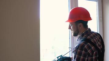 Windows installation worker use of foam when installing windows video