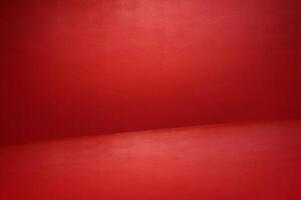 The floor and walls of the room are red as the background. photo