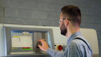 Print house worker setting parameters on modern offset printing machine video
