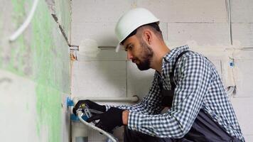 Plumber installs or change water filter in new apartment. Replacement aqua filter video