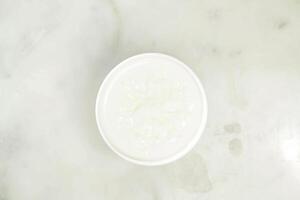 Protein Almond Tea served in cup isolated on grey background top view of asian drink photo