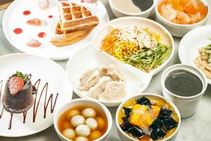 cold noodles, shredded chicken and dumplings Strawberry Souffle Waffles, Molten chocolate lava cake, Ginger sesame soup balls, Mango sago grass Jelly, Stewed Papaya Snow Fungus, Sesame paste photo