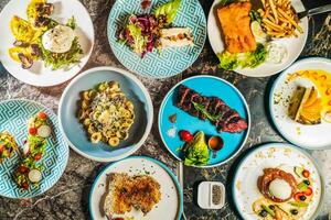 grilled Beef belly steak, Orecchiette Pasta with Spinach, Mushrooms, Porcini wontons with buffalo mozzarella, Fried cod fish and chips, Roasted Spring Chicken, French Apple Batch, New York Cheesecake photo