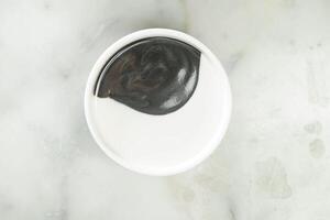 Sesame Cashew Dew paste dip served in bowl isolated on grey background top view of asian food photo