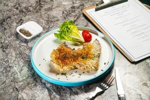 Whole Grilled Chicken with Pesto and Mustard Sauce or Roasted Spring Chicken with dip, fork and knife served in plate isolated on marble background side view of hong kong food photo