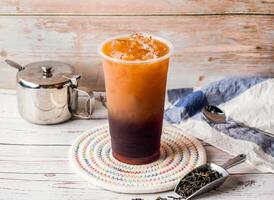Ice Winter Melon with Lemon Tea with sugar pot and spoon served in disposable glass isolated on table side view of hong kong tea photo