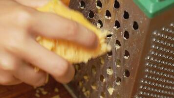 Close-Up of Hand Grateing a Cheese on a Grater video