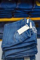 Close up of blue jeans on others with copy space, Various jeans on others with space for text photo