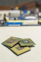Three computer processors with one computer motherboard, computer processor concept photo