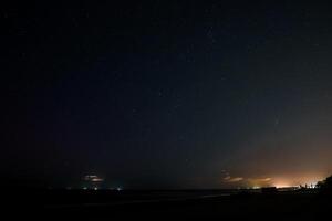 Lightning thunderstorm flash over the night sky. Concept on topic weather, cataclysms, hurricane, Typhoon, tornado, storm in Latvia over the Baltic sea. photo