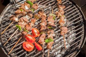Top view of delicious grilled meat skewers. grilled homemade roast beef skewers photo