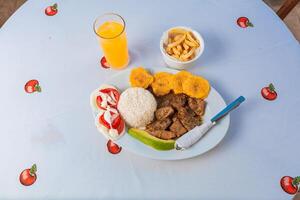 Tradicional lunch served at the table. Top view of traditional lunch with orange juice on the table. photo
