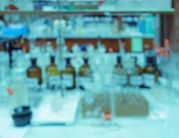 Blurred abstract background of workbench in chemistry laboratory photo