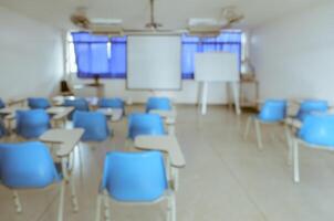 Blurred abstract image background of empty school classroom or university lecture room photo
