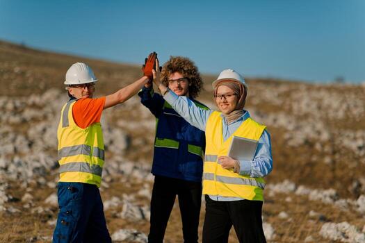 Engineers Collaborating in the Field to Inspect and Optimize Electric Turbines. photo