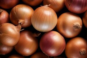 A pile of fresh onion form the background, shown from above photo