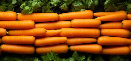 A pile of fresh carrot form the background, shown from above photo