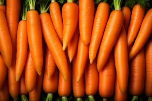 A pile of fresh carrot form the background, shown from above photo
