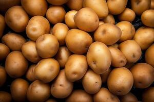 A pile of fresh potato form the background, shown from above photo