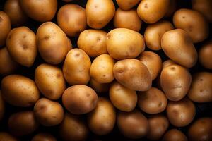 A pile of fresh potato form the background, shown from above photo