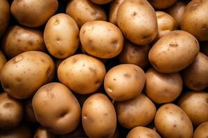 A pile of fresh potato form the background, shown from above photo