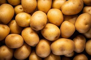 A pile of fresh potato form the background, shown from above photo
