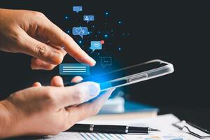 Person using smartphone taps on social media icon, initiating chat and communication within their network. chat, social, communication, icon, media, message, Concept central to modern messaging. photo