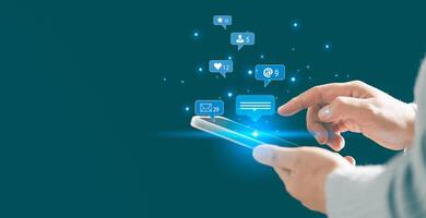 Person using smartphone taps on social media icon, initiating chat and communication within their network. chat, social, communication, icon, media, message, Concept central to modern messaging. photo