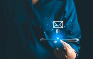 Businesses send electronic mail and newsletters to clients as part of their online marketing strategy, delivering messages through various platforms like social media and phone. electronic mail. photo