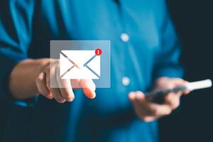 Businesses send electronic mail and newsletters to clients as part of their online marketing strategy, delivering messages through various platforms like social media and phone. electronic mail. photo