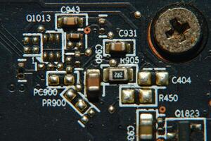close up of a circuit board with many electronic components photo