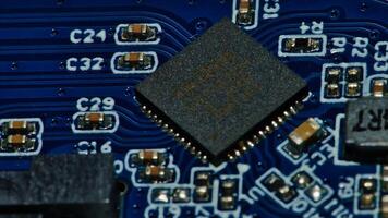 a close up of a microchip on a blue circuit board photo