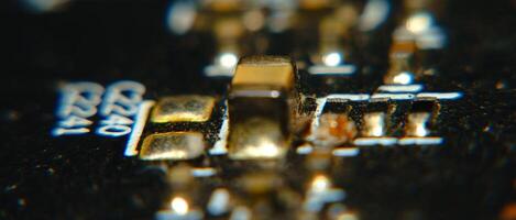 close up of a circuit board with a gold and black color photo