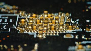 close up of a computer motherboard with gold and black components photo