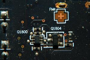 a close up of a circuit board with a small electronic device photo