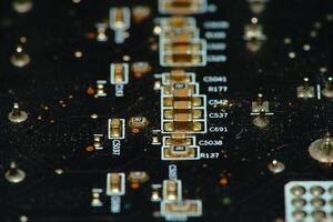 close up of a circuit board with many electronic components photo