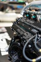 Stuttgart, Germany, August 13, 2023. Car engine part. New engine new car. Clean car engine separately from the body. Close-up of a sports car engine. photo