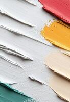 Layers of textured white paint on canvas creating a smooth artistic surface photo