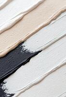 Layers of textured white paint on canvas creating a smooth artistic surface photo