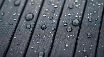 Water droplets on textured wooden surface after rain photo