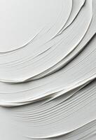 Layers of textured white paint on canvas creating a smooth artistic surface photo