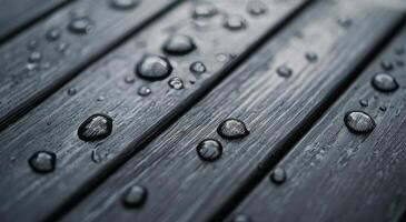 Water droplets on textured wooden surface after rain photo